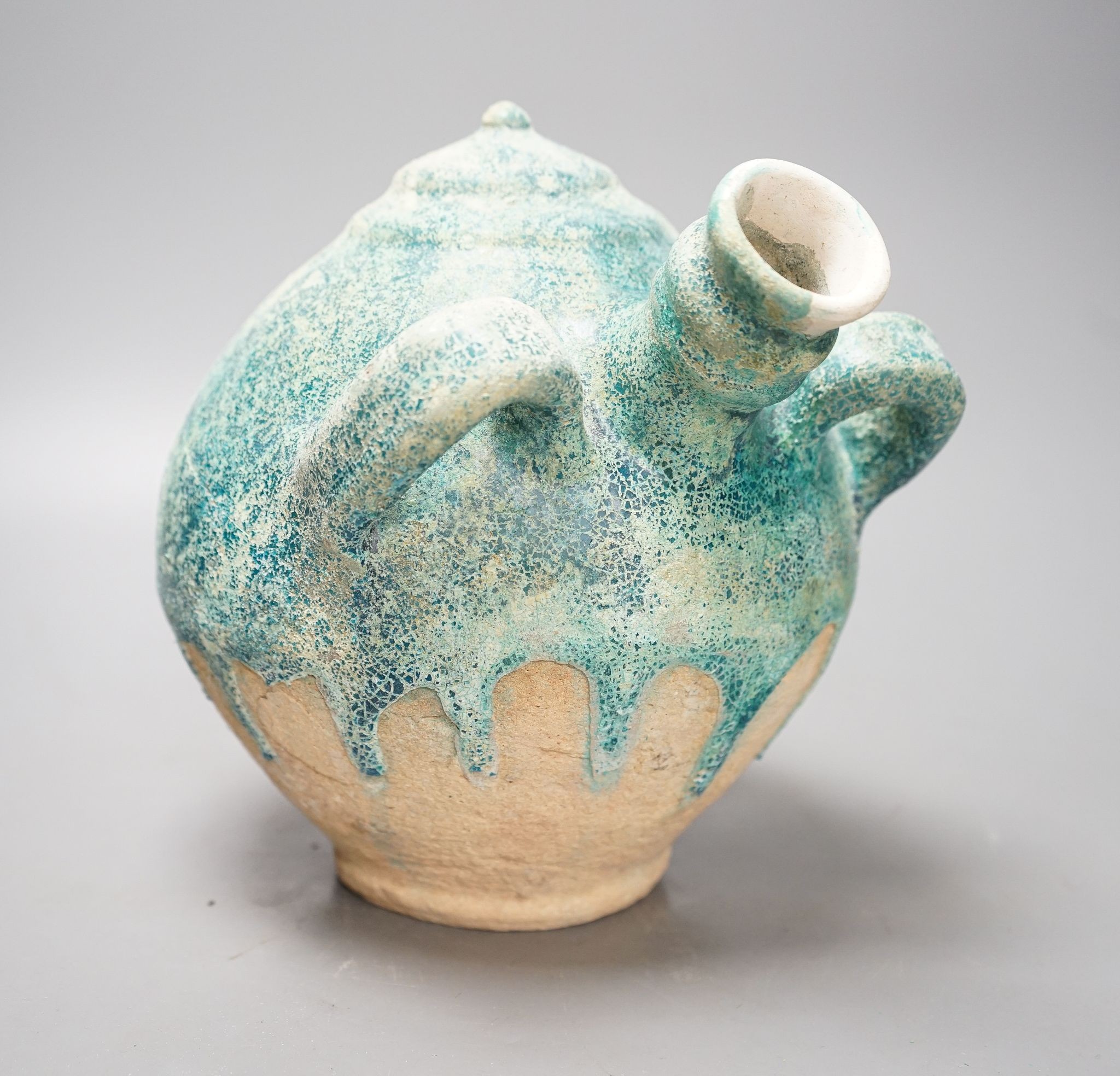 A Kashan turquoise gazed jar, 13th/14th century, 22cm